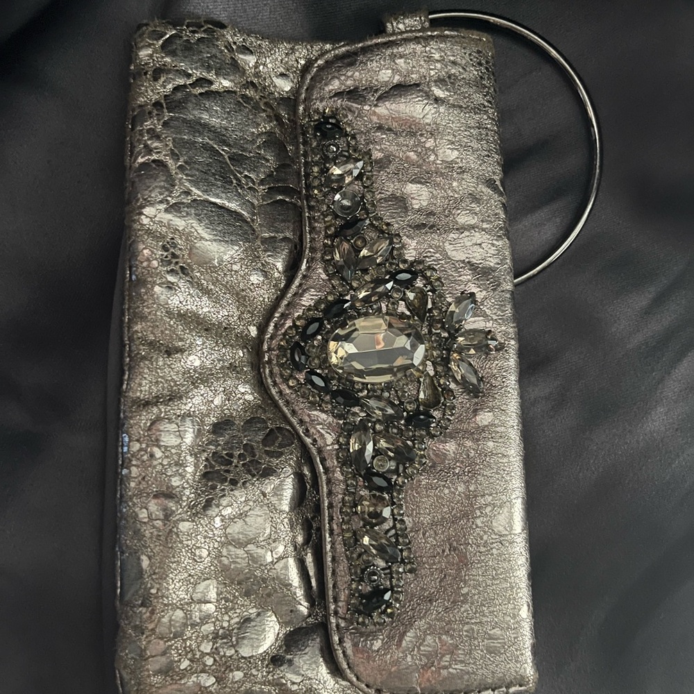 Guess Silver Clutch with Unique Textured Design and Decorative Zipper